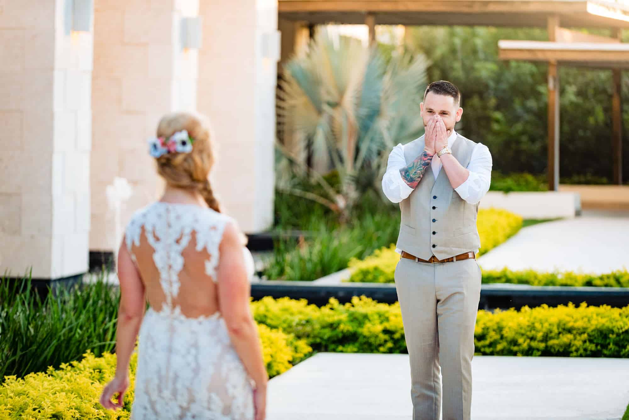 grooms hands to his face after first look with bride grooms hands to his face after first look with bride